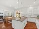 Open-concept kitchen with stainless appliances, granite countertops, island, and seamless flow to living space at 1016 Hickory Pine Rd, Waxhaw, NC 28173