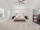 Expansive main bedroom with neutral carpet, high ceiling, and windows for ample natural light at 1016 Hickory Pine Rd, Waxhaw, NC 28173