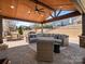 Covered outdoor space with cozy seating, perfect for relaxation and entertaining at 1016 Hickory Pine Rd, Waxhaw, NC 28173