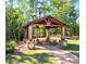 Inviting wooden pavilion with comfortable seating, perfect for outdoor gatherings and relaxation at 1016 Hickory Pine Rd, Waxhaw, NC 28173