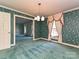 Bright dining room area with natural light, ornate drapes, and a classic light fixture at 1026 Norwich Rd, Charlotte, NC 28227