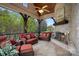 Inviting screened porch with stone fireplace and comfortable seating perfect for outdoor relaxation at 105 Grey Lady Ct, Mooresville, NC 28117