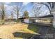 Wide shot of backyard featuring a detached garage and carport at 106 W 16Th St, Kannapolis, NC 28081