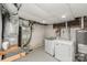Basement laundry area with washer, dryer, furnace, and hot water heater at 106 W 16Th St, Kannapolis, NC 28081