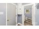 Hallway view of bathroom featuring a medicine cabinet and modern flooring at 106 W 16Th St, Kannapolis, NC 28081