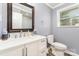 Bathroom with a bright vanity, neutral walls, and a window for natural lighting at 106 W 16Th St, Kannapolis, NC 28081