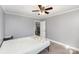 Cozy bedroom featuring neutral walls, carpet floors, and a ceiling fan at 106 W 16Th St, Kannapolis, NC 28081