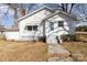 Charming single-story home featuring a classic design, complemented by a walkway leading to the front door at 106 W 16Th St, Kannapolis, NC 28081