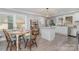 Bright eat-in kitchen with stainless steel appliances, white cabinetry and an island at 106 W 16Th St, Kannapolis, NC 28081