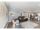 Open-concept living room with lots of natural light, neutral decor, and wood laminate flooring at 106 W 16Th St, Kannapolis, NC 28081