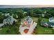 The home's aerial view displays professional landscaping, mature trees, and circular driveway at 109 Dabbling Duck Cir, Mooresville, NC 28117