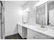 Bathroom with dual sinks, marble countertops, and a glass enclosed shower at 109 Dabbling Duck Cir, Mooresville, NC 28117