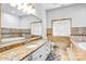 Elegant bathroom with granite countertops, soaking tub, and natural stone tile at 109 Dabbling Duck Cir, Mooresville, NC 28117