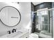 Modern bathroom featuring dark tile shower, glass door, white countertops, and contemporary fixtures at 109 Dabbling Duck Cir, Mooresville, NC 28117