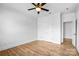 Bedroom with wood flooring, a ceiling fan, and closet at 109 Dabbling Duck Cir, Mooresville, NC 28117