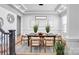 Elegant dining room with coffered ceilings, modern lighting, and a spacious table setting for formal gatherings at 109 Dabbling Duck Cir, Mooresville, NC 28117