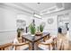 Spacious dining area featuring hardwood floors, coffered ceilings, and open concept design into other living spaces at 109 Dabbling Duck Cir, Mooresville, NC 28117