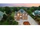 Majestic brick home with a grand entrance, manicured landscaping, and ample parking at twilight at 109 Dabbling Duck Cir, Mooresville, NC 28117