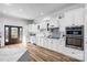 Bright and open kitchen with stainless appliances, white cabinets, and eat-in breakfast bar at 109 Dabbling Duck Cir, Mooresville, NC 28117