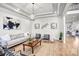 Stylish living room with modern decor, hardwood flooring, and abundant natural light, creating a welcoming atmosphere at 109 Dabbling Duck Cir, Mooresville, NC 28117