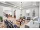 Bright and airy living room with hardwood floors, white walls, coffered ceilings, and elegant furnishings at 109 Dabbling Duck Cir, Mooresville, NC 28117