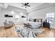 Inviting main bedroom featuring an area rug, tray ceilings, and natural lighting at 109 Dabbling Duck Cir, Mooresville, NC 28117