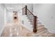 Staircase featuring wood steps and wrought iron railings at 109 Dabbling Duck Cir, Mooresville, NC 28117