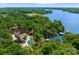 Aerial view of a lakefront home with a pool, private dock, and lush landscape at 1220 Broadside Rd, York, SC 29745