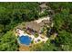 Stunning aerial view of an estate with a pool, manicured lawns, and a private setting at 1220 Broadside Rd, York, SC 29745