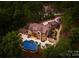 Stunning aerial view of a luxurious estate home with a beautiful pool and lush landscaping at 1220 Broadside Rd, York, SC 29745