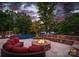 Backyard featuring a swimming pool, fire pit, built-in bench, lounge seating, and a lake view at 1220 Broadside Rd, York, SC 29745