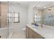 Bright bathroom with a glass shower and decorative tile work, complemented by natural wood accents at 1220 Broadside Rd, York, SC 29745