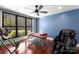 Bedroom featuring a massage table, massage chair, ceiling fan, and a large window at 1220 Broadside Rd, York, SC 29745