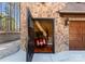 Stone front entry with motorcycle parked inside, stone wall, and interior staircase at 1220 Broadside Rd, York, SC 29745