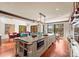 Gourmet kitchen featuring a large island, modern appliances, and a view of the serene lake at 1220 Broadside Rd, York, SC 29745