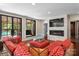 Stylish living room with a fireplace, mounted tv, and a window overlooking an outdoor area at 1220 Broadside Rd, York, SC 29745