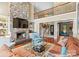 Spacious living room with a stone fireplace, a large TV, and an open layout perfect for entertaining at 1220 Broadside Rd, York, SC 29745