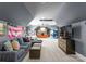 Spacious entertainment room with multiple seating areas and decorative elements including a USA flag at 1220 Broadside Rd, York, SC 29745
