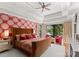 Spacious main bedroom with decorative wallpaper, tray ceiling, and scenic outdoor views at 1220 Broadside Rd, York, SC 29745