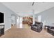 Inviting living room featuring a cozy seating arrangement that flows directly into an open kitchen and dining area at 12852 Mustang Dr, Midland, NC 28107