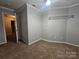 Bedroom with neutral paint and ceiling fan, closet at 1516 Plantation Trl, Gastonia, NC 28056