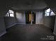 Attic bedroom with carpeted flooring, windows, and neutral wall color at 1516 Plantation Trl, Gastonia, NC 28056