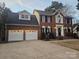 Well-maintained brick home featuring an attached two-car garage and a classic design at 1516 Plantation Trl, Gastonia, NC 28056