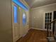 Inviting foyer features wood floors and a decorative glass front door at 1516 Plantation Trl, Gastonia, NC 28056