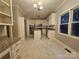 Large eat-in kitchen boasting granite countertops, white cabinets, and stainless steel appliances at 1516 Plantation Trl, Gastonia, NC 28056