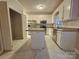 Bright kitchen with white cabinets, granite countertops, and stainless steel appliances at 1516 Plantation Trl, Gastonia, NC 28056