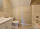 Bathroom featuring tile floors, a tub, and a toilet at 159 S Gibbs Rd, Mooresville, NC 28117