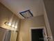 A light fixture is covered with plastic in this bathroom at 159 S Gibbs Rd, Mooresville, NC 28117