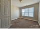 Bedroom featuring carpet floors and a window at 159 S Gibbs Rd, Mooresville, NC 28117