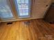Bedroom view featuring hardwood floors, natural light from windows and a white entry door at 159 S Gibbs Rd, Mooresville, NC 28117